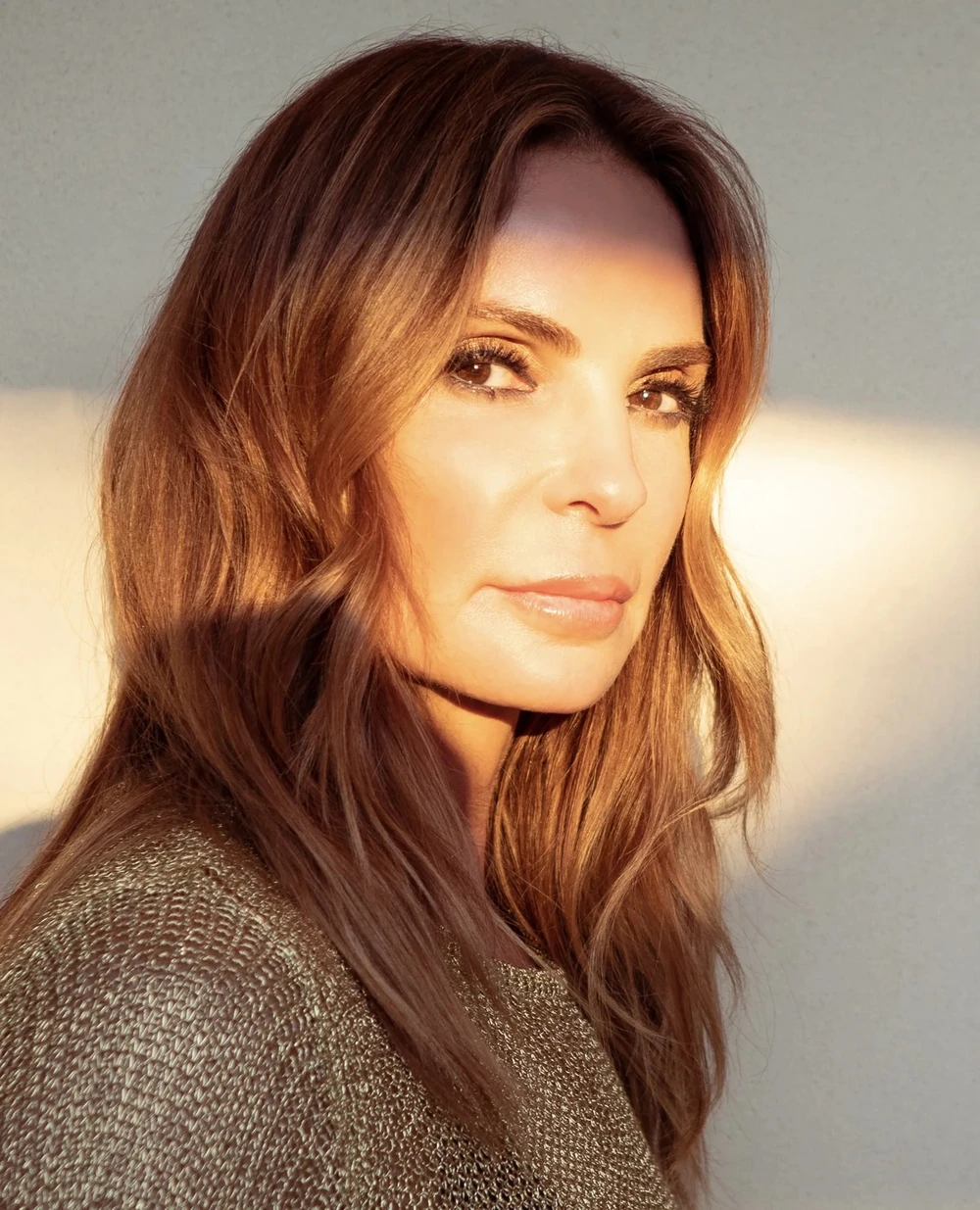Regina Duke, founder of THE RECORD, in warm evening light